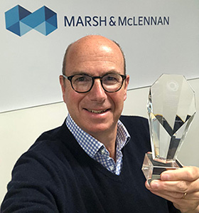 Chris Lay, CEO, holding award